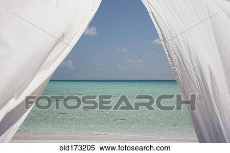 Stock Photography - Curtains over ocean seascape. Fotosearch