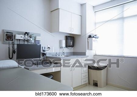 Stock Image - Empty bed and television in hospital room. Fotosearch