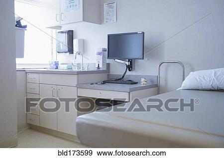 Stock Photo - Empty bed and television in hospital room. Fotosearch