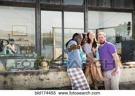 Friends taking selfie in backyard View Large Photo Image Stock Photography - Friends taking selfie in backyard. Fotosearch
