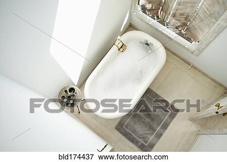 Stock Photo - High angle view of bubble bath in bathroom. Fotosearch
