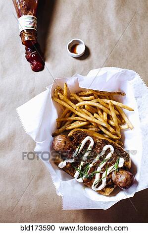 High angle view of chili dog with french fries View Large Photo Image Stock Image - High angle view of chili dog with french fries. Fotosearch