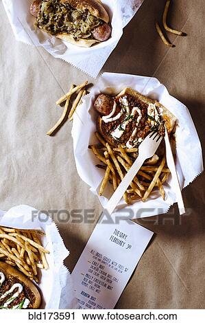 High angle view of chili dog with french fries View Large Photo Image Stock Image - High angle view of chili dog with french fries. Fotosearch