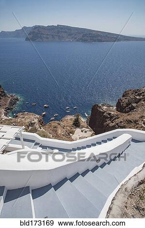 Stock Photo - High angle view of hillside steps over ocean. Fotosearch