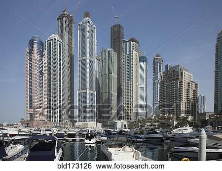 Highrise buildings in Dubai cityscape, Dubai Emirate, United Arab Emirates View Large Photo Image Stock Photograph - Highrise buildings in Dubai cityscape, Dubai Emirate, United Arab Emirates. Fotosearch