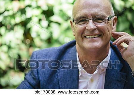 Hispanic businessman smiling outdoors View Large Photo Image Stock Photo - Hispanic businessman smiling outdoors. Fotosearch