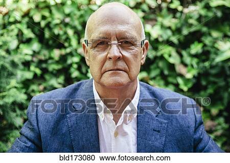 Stock Image - Hispanic businessman with serious expression. Fotosearch