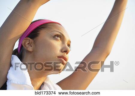 Hispanic woman stretching outdoors View Large Photo Image Picture - Hispanic woman stretching outdoors. Fotosearch