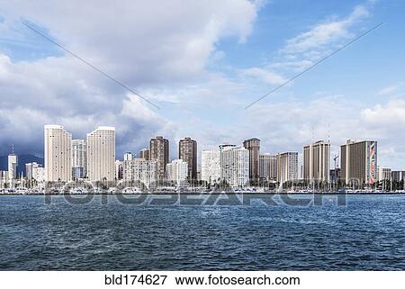 Honolulu city skyline over ocean, Hawaii, United States View Large Photo Image Stock Photo - Honolulu city skyline over ocean, Hawaii, United States. Fotosearch
