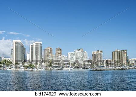 Honolulu city skyline over ocean, Hawaii, United States View Large Photo Image Stock Photo - Honolulu city skyline over ocean, Hawaii, United States. Fotosearch