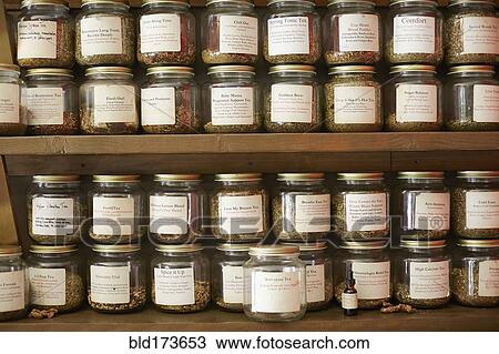 Stock Image - Jars of variety of teas in tea shop. Fotosearch
