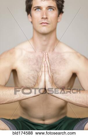 Man practicing yoga in studio View Large Photo Image Stock Photo - Man practicing yoga in studio. Fotosearch