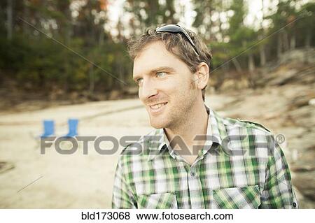 Stock Photo - Man standing in clearing. Fotosearch