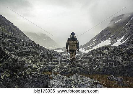 Mari hiker admiring mountain valley View Large Photo Image Stock Photograph - Mari hiker admiring mountain valley. Fotosearch