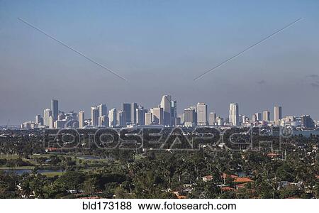 Stock Photo - Miami city skyline under blue sky. Fotosearch