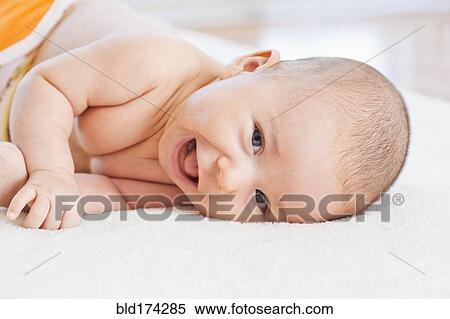 Mixed race baby laying on blanket View Large Photo Image Stock Photography - Mixed race baby laying on blanket. Fotosearch