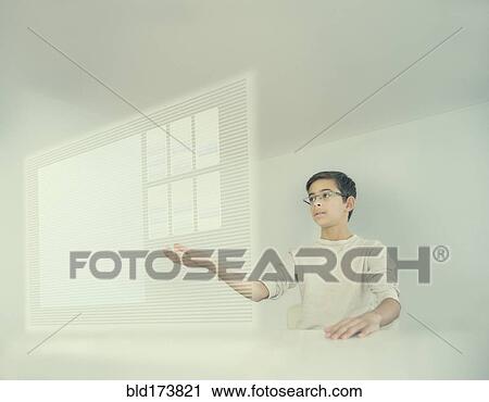 Mixed race boy using holographic screen View Large Photo Image Stock Image - Mixed race boy using holographic screen. Fotosearch