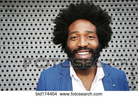 Picture - Mixed race businessman smiling. Fotosearch