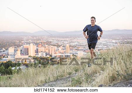 Mixed race man running on hilltop over Salt Lake City, Utah, United States View Large Photo Image Stock Image - Mixed race man running on hilltop over Salt Lake City, Utah, United States. Fotosearch