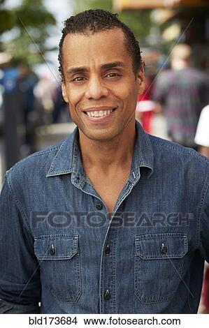 Mixed race man smiling View Large Photo Image Picture - Mixed race man smiling. Fotosearch