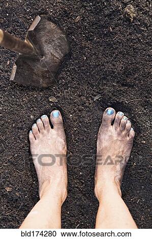 Mixed race woman barefoot in dirt View Large Photo Image Stock Image - Mixed race woman barefoot in dirt. Fotosearch