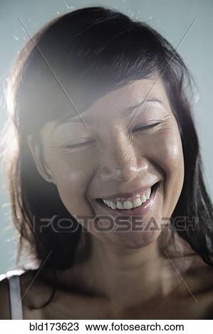Mixed race woman smiling View Large Photo Image Stock Image - Mixed race woman smiling. Fotosearch