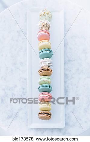 Stock Photo - Overhead view of variety of macaroon cookies. Fotosearch