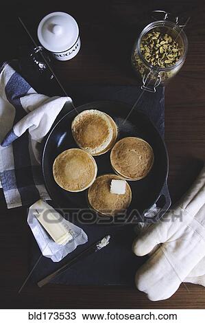 Stock Image - Pancake, sugar, nut and butter on table. Fotosearch