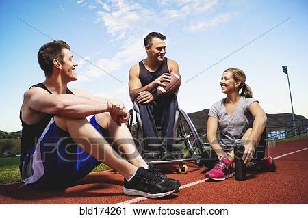 Paraplegic athlete in wheelchair and friends on track View Large Photo Image Stock Image - Paraplegic athlete in wheelchair and friends on track. Fotosearch