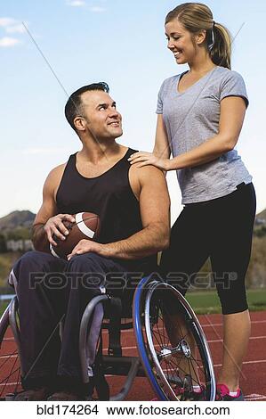 Paraplegic athlete in wheelchair with girlfriend View Large Photo Image Picture - Paraplegic athlete in wheelchair with girlfriend. Fotosearch