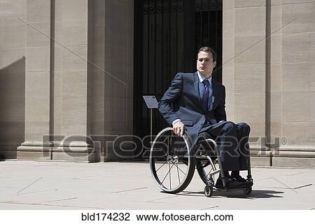 Paraplegic businessman sitting in wheelchair View Large Photo Image Stock Image - Paraplegic businessman sitting in wheelchair. Fotosearch