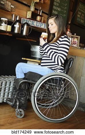 Paraplegic woman in wheelchair drinking coffee View Large Photo Image Stock Photo - Paraplegic woman in wheelchair drinking coffee. Fotosearch