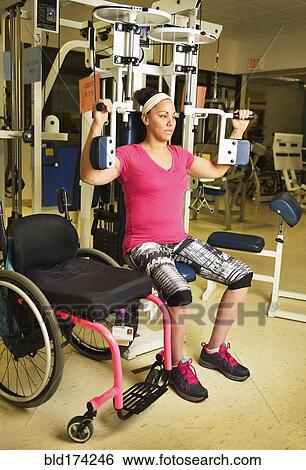 Paraplegic woman working out in physical therapy View Large Photo Image Stock Photograph - Paraplegic woman working out in physical therapy. Fotosearch