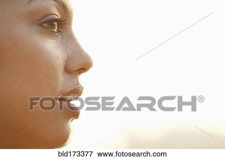 Stock Photo - Profile of sweating Hispanic woman. Fotosearch