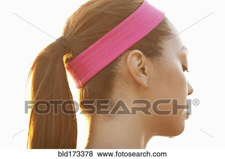 Stock Photo - Rear view of sweating Hispanic woman. Fotosearch