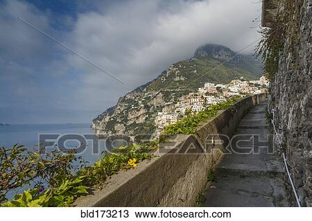 Stock Image - Rocky balcony overlooking Positano cityscape, Amalfi Peninsula, Italy. Fotosearch