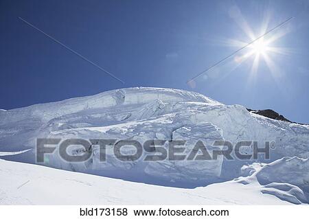 Sunshine over snow drift View Large Photo Image Stock Photo - Sunshine over snow drift. Fotosearch