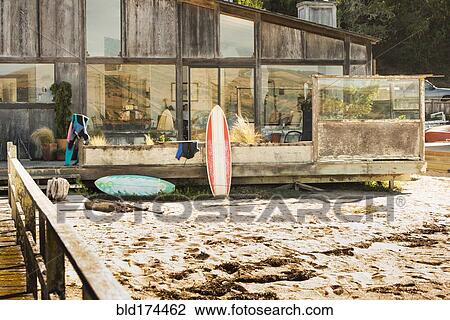 Surfboards in backyard of beach house View Large Photo Image Stock Image - Surfboards in backyard of beach house. Fotosearch