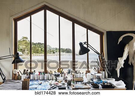 Stock Photo - Window and desk in studio of artist. Fotosearch