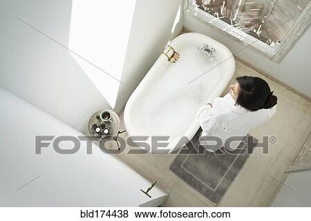 Woman having bubble bath in bathroom View Large Photo Image Stock Photo - Woman having bubble bath in bathroom. Fotosearch