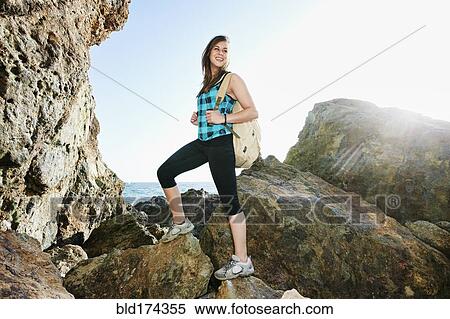 Woman hiking on boulders View Large Photo Image Stock Photography - Woman hiking on boulders. Fotosearch