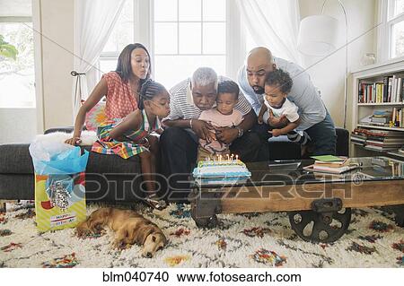 Stock Image - African American family celebrating birthday. Fotosearch