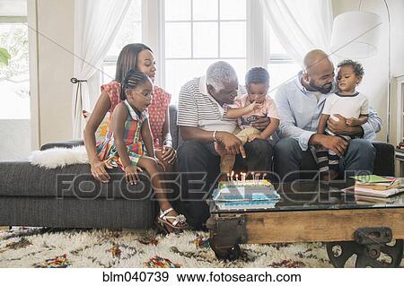 Stock Photo - African American family celebrating birthday. Fotosearch