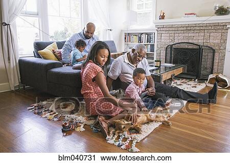 African American family relaxing in living room View Large Photo Image Stock Image - African American family relaxing in living room. Fotosearch
