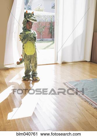 African American girl wearing dragon costume View Large Photo Image Stock Image - African American girl wearing dragon costume. Fotosearch