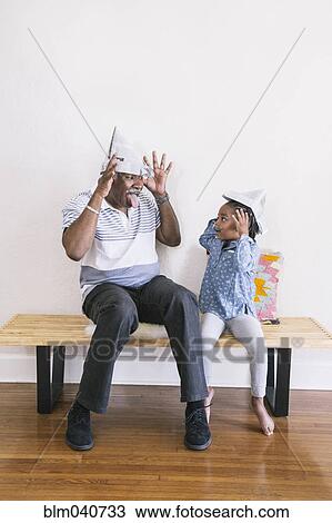 African American grandfather and granddaughter playing on bench View Large Photo Image Stock Image - African American grandfather and granddaughter playing on bench. Fotosearch