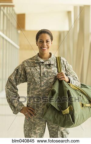 Stock Photography - African American soldier smiling in airport. Fotosearch