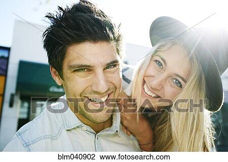 Stock Image - Caucasian couple smiling outdoors. Fotosearch