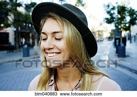 Stock Image - Caucasian woman smiling outdoors. Fotosearch
