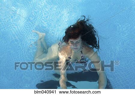 Caucasian woman swimming in pool View Large Photo Image Stock Image - Caucasian woman swimming in pool. Fotosearch